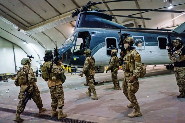 <strong>Taliban fighters from the Fateh Zwak unit wielding American supplied weapons, equipment and uniforms, storm into Kabul airport to secure the airport and inspect the equipment that was left behind.</strong>