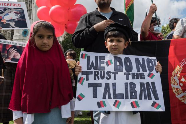 Children demonstrating in Parliament Square as MPs hold a debate on the crisis in Afghanistan.