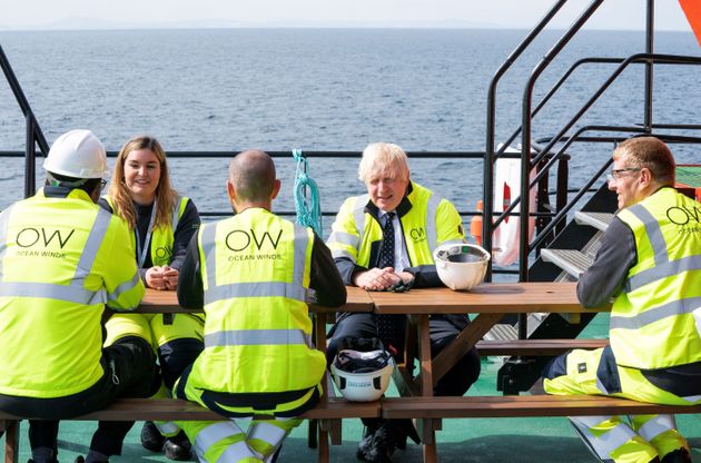 Boris Johnson meets workers during a visit to Scotland in August. The prime minister is expected to make an announcement on a National Insurance hike this week.