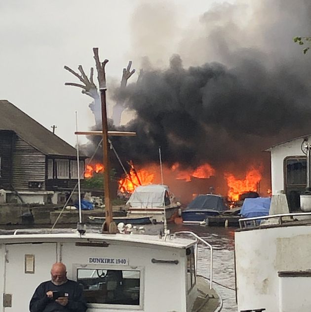 Handout photo taken with permission from the twitter feed of @drbouchard of a large fire that has broken out at Hampton Boat Sheds in Hampton, London. Picture date: Monday May 3, 2021.