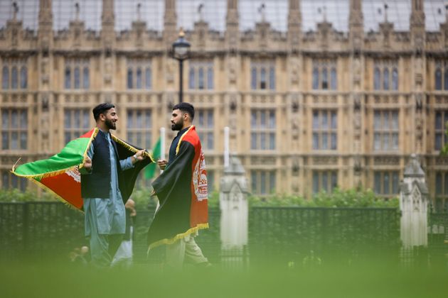 A group of protesters against the Taliban take over of Afghanistan gather in Parliament Square.