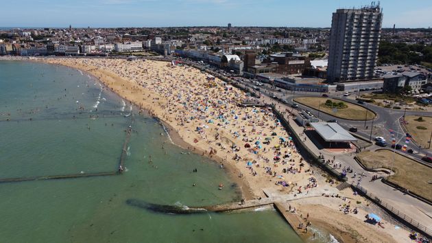 Beachgoers at Margate tidal pool during high tide on July 16, 2022 in Margate, United Kingdom. 