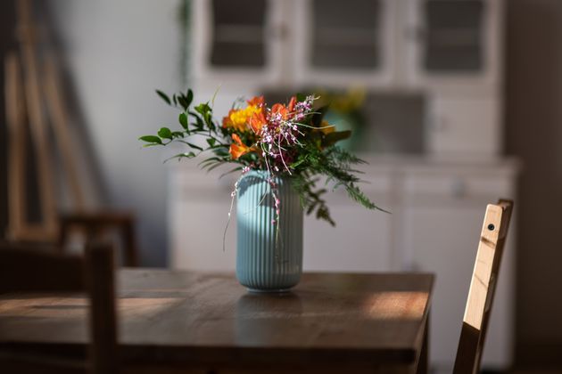 Don't make the host scramble to find a vase for your flowers.