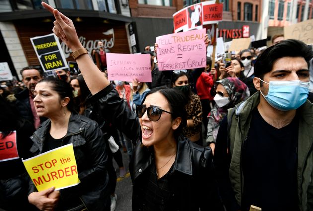 Members of the Iranian community in Ottawa and their supporters rally Sunday in solidarity with protesters in Iran after 22-year-old Mahsa Amini died in police custody for improperly wearing a hijab.