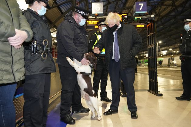 <strong>Boris Johnson talks to British Transport Police officers and police dog Ozzy at Liverpool Lime Street station as part of 'Operation Toxic' to infiltrate county lines drug dealings.</strong>