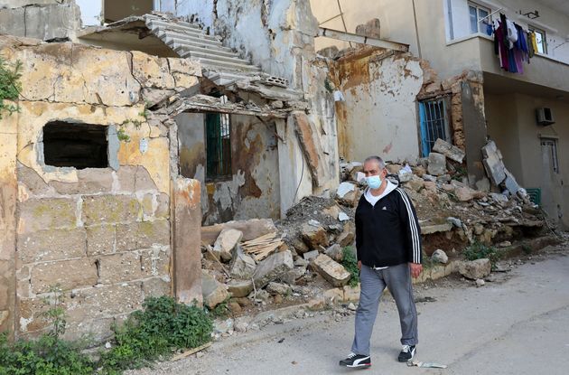 Local resident outside buildings damaged by the explosion.