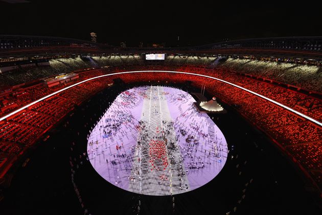 Members of Team China enter the stadium.