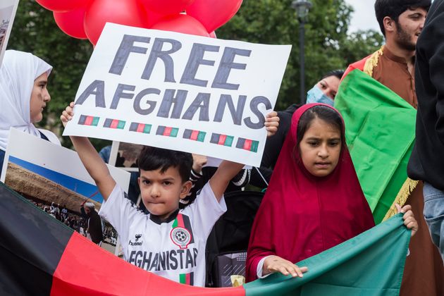 Demonstrators in Parliament Square demand help for refugees