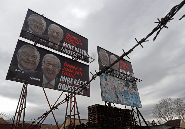 BUDAPEST, HUNGARY - FEBRUARY 22: A billboard seen with portraits of European Commission chief Jean-Claude Juncker and Hungarian-born US billioner George Soros and a slogan reading 