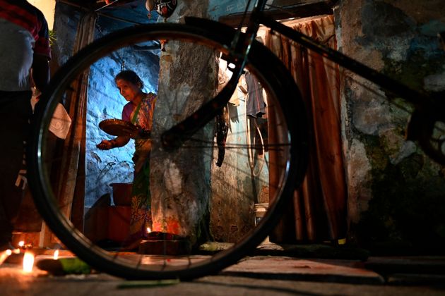 Hindu devotees perform the ritual worship Ayudha Puja on their bicycles on the occasion of the Dussehra-Vijay Dashami festival in New Delhi, on Oct. 14.