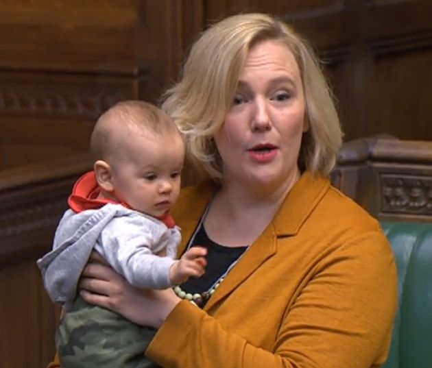 Labour MP Stella Creasy holds her baby daughter in the Commons 