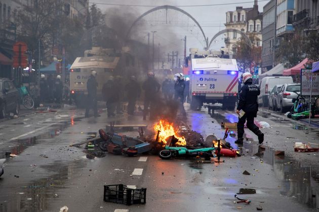 Riot police are at work to clear the street during clashes with football fans 