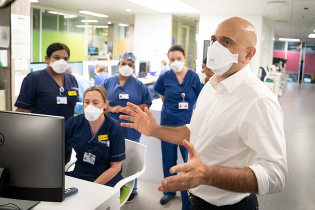 <strong>Health secretary Sajid Javid meets staff in a Covid Intensive Care Unit during a visit to Kings College Hospital in London on Friday.</strong>