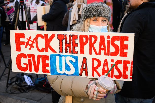 Nurses and supporters gather to demonstrate outside St Thomas' hospital in Westminster on December 15, 2022 in London, England.