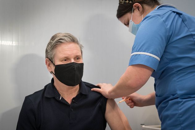 Keir Starmer receives his first dose of the AstraZeneca coronavirus vaccine from midwife, Emily Malden at the Francis Crick Institute in his Holborn and St Pancras seat, in March