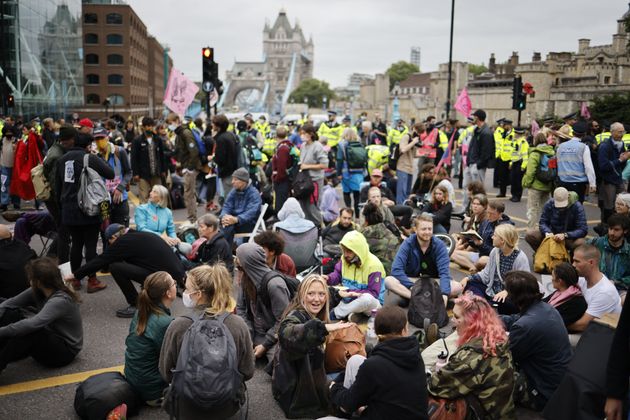 <strong>Climate activists from the Extinction Rebellion group block the road leading to Tower Bridge in central London.</strong>