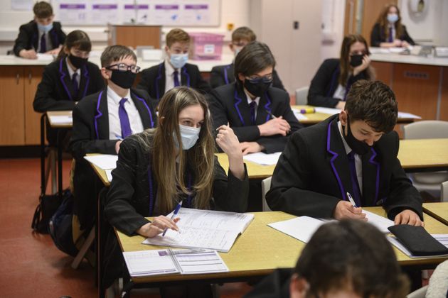 Year 10 students wearing face masks at Park Lane Academy in Halifax, northwest England on January 4, 2022. 