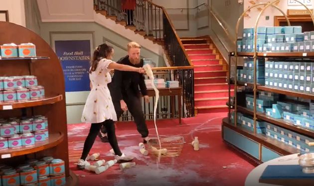 Grab from video issued by Animal Rebellion of supporters of Animal Rebellion pouring out milk in Fortnum & Mason in London.