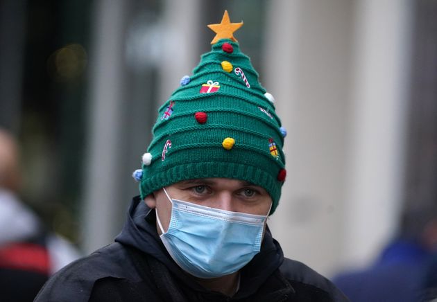 <strong>A Christmas shopper wears a festive hat on Buchanan Street in Glasgow.</strong>