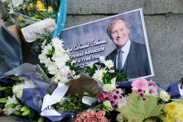 Floral tributes for Sir David Amess, outside the entrance to the Houses of Parliament 