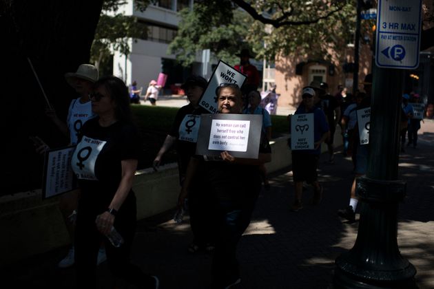 A Texas protester holds a sign with the Margaret Sanger quote, 