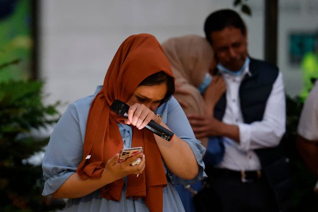 <strong>Jebina Yasmin Islam reacts as she pays tribute to her sister during the vigil.</strong>