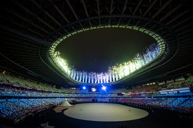 Fireworks flash above the National Stadium.