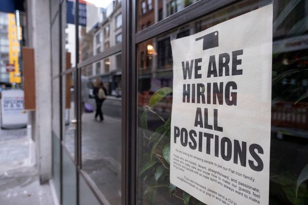 Recruitment poster in the window of a restaurant in the West End on 3rd February 2022.