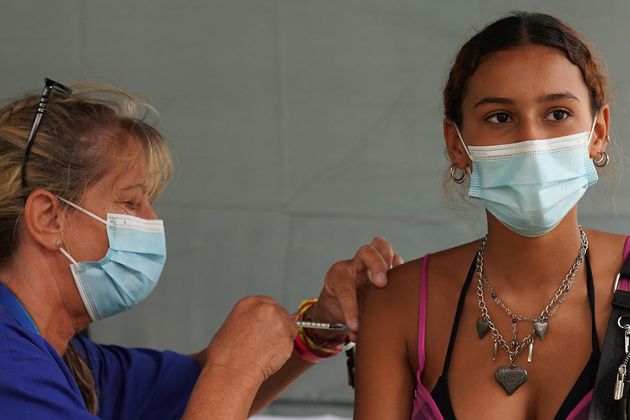 A festival-goer gets an injection at a walk-in Covid-19 vaccination clinic at the Reading Festival on August 26, 2021.