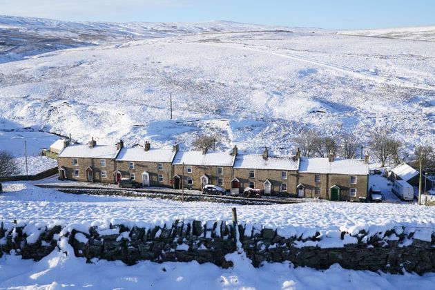 <strong>Snow covered fields and rooftops in Allenheads in the Pennines to the north of Weardale in Northumberland.</strong>