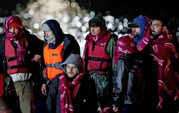 A group of people thought to be migrants are brought in to Dover, Kent, following a small boat incident in the Channel after 27 people drowned on Wednesday