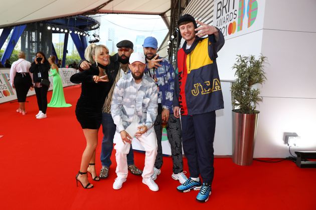 Sheridan Smith poses with the Kurupt FM team backstage at the Brits