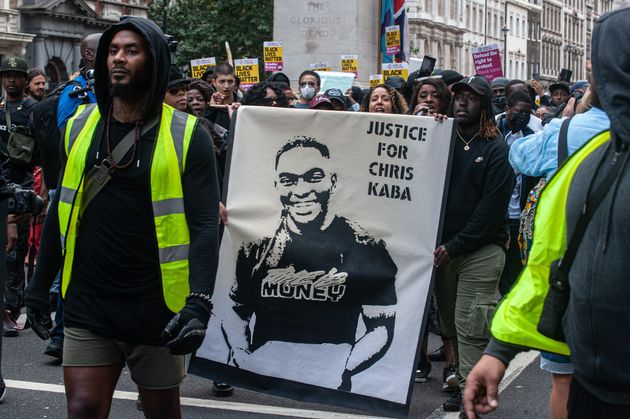 Thousands gathered in London holding placards with messages including 