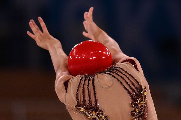 TOPSHOT - USA's Evita Griskenas competes in the individual all-around qualification of the Rhythmic Gymnastics event during Tokyo 2020 Olympic Games at Ariake Gymnastics centre in Tokyo, on August 6, 2021. (Photo by Martin BUREAU / AFP) (Photo by MARTIN BUREAU/AFP via Getty Images)