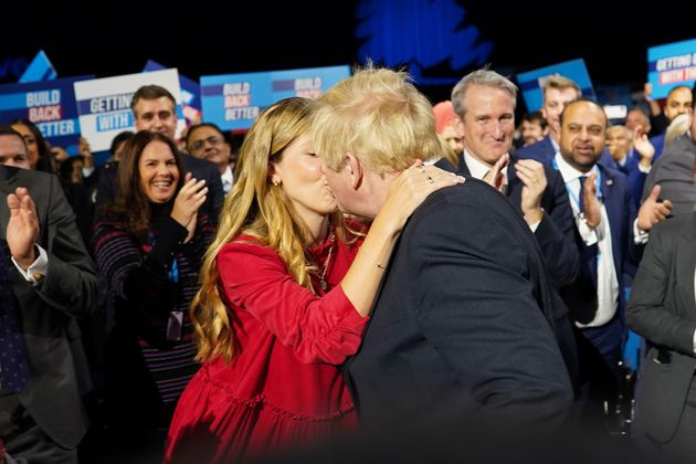 Carrie Johnson greets her husband before his leader's speech 