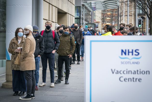 <strong>People queue outside the Edinburgh International Conference Centre (EICC) for the NHS Scotland vaccination centre.</strong>