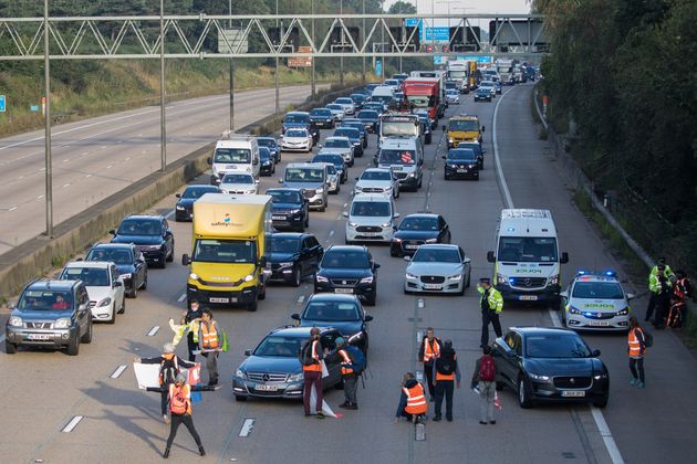 <strong>Insulate Britain climate activists begin to block the anticlockwise carriageway of the M25 between Junctions 9 and 10 as part of a campaign intended to push the UK government to make significant legislative change to start lowering emissions.</strong>