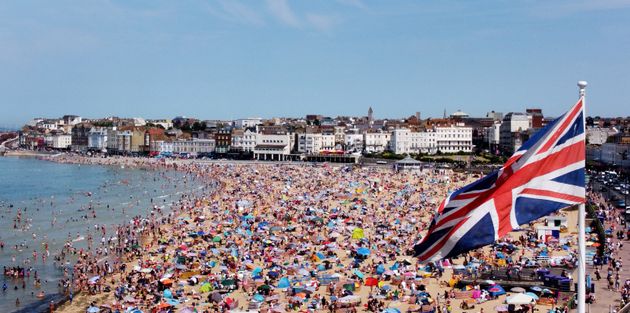 A view of people on the beach in Margate, Kent, on Sunday July 17, 2022.