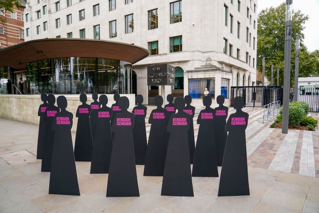 <strong>Silhouettes of women are placed outside New Scotland Yard by the British charity Refuge.</strong>