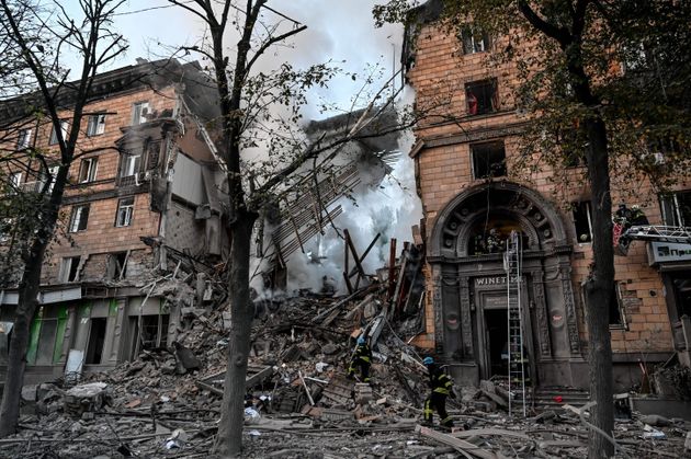 Ukrainian firefighters push out a fire after a strike in Zaporizhzhia on October 6, 2022, amid the Russian invasion of Ukraine.