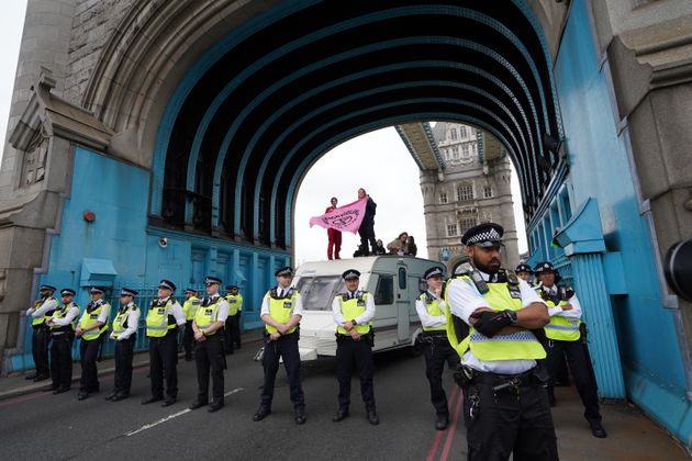 <strong>Police by a caravan on Tower Bridge, central London after members of Extinction Rebellion blocked the road.</strong>