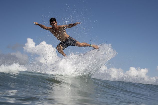 Chile's Manuel Selman rides a wave during a free training session.