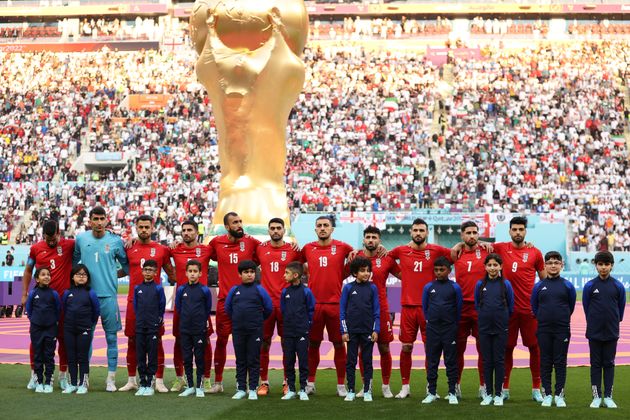 Iran players line up for the national anthem.