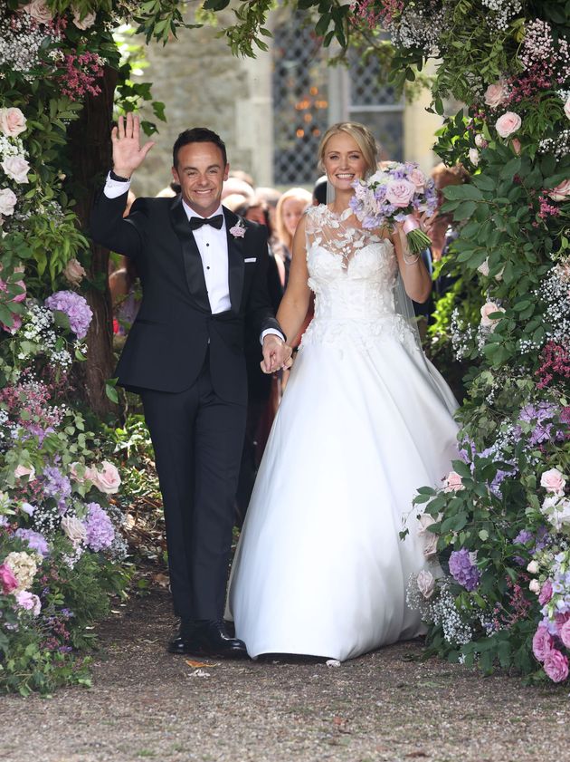 The newlyweds beamed as they left the church