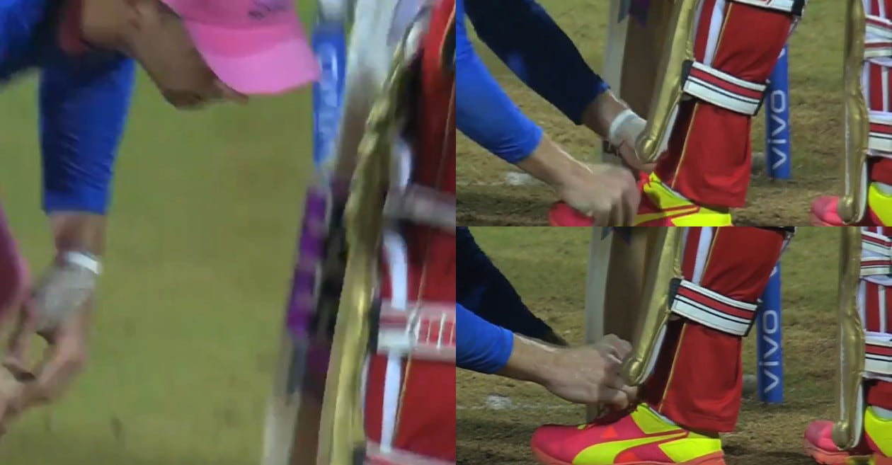 Jos Buttler ties the shoelaces of Devdutt Padikkal