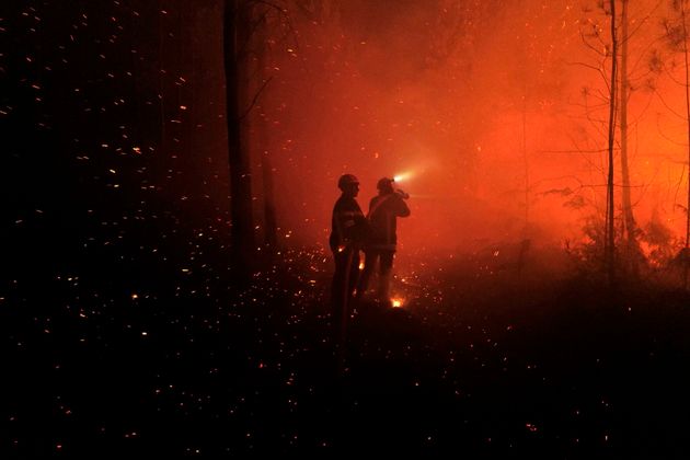 This photo provided by the fire brigade of the Gironde region (SDIS 33) shows firefighters working against a wildfire near Landiras, southwestern France, Saturday July 16, 2022. Firefighters are struggling to contain wildfires in France and Spain as Europe wilts under an unusually extreme heat wave that authorities link to a rise in excess mortality. (SDIS 33 via AP)