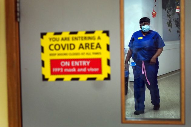 <strong>A nurse walks through a Covid ward at King's College Hospital, in south east London.</strong>