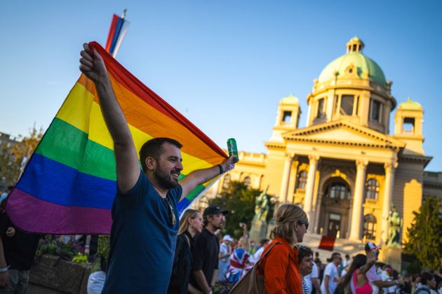 A man holds a rainbow flag during the annual Belgrade Pride march on September 9, 2023.