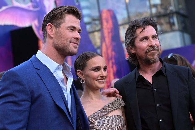 Christian with co-stars Chris Hemsworth and Natalie Portman