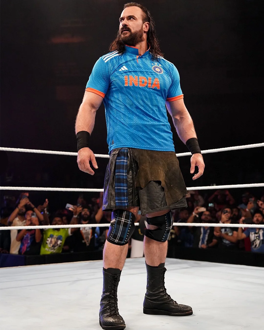 Drew McIntyre wearing India's ODI jersey